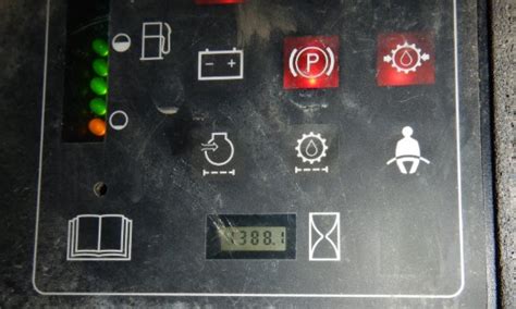 skid steer warning light symbol